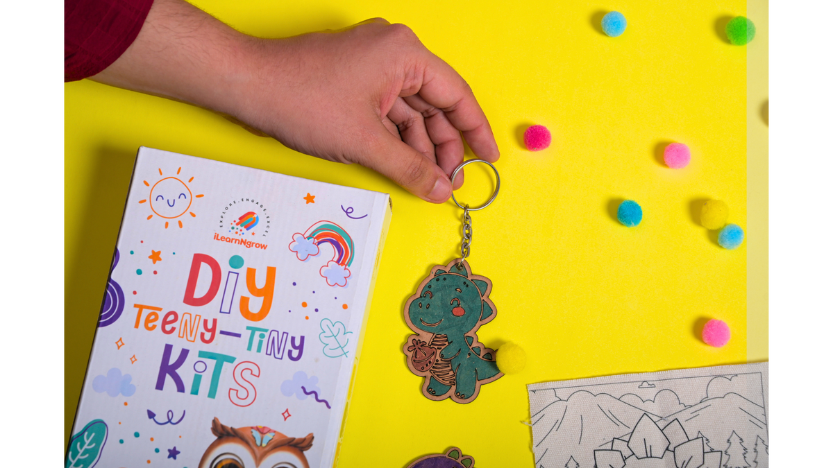 iLearnNGrow Dino Rakhi Combo – DIY Dinosaur Painting Kit with Dino Keychain, Fridge Magnet, Canvas Painting & Dino Rakhi
