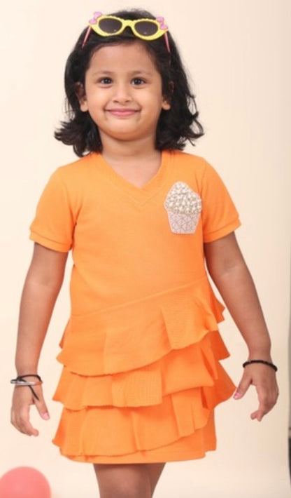Orange Polo Dress With V-Neck And Flattering Ruffles All Over With Hand-Made Cupcake Embellishment